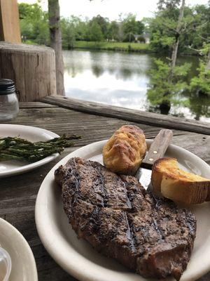 Ribeye with stuffed potato and asparagus