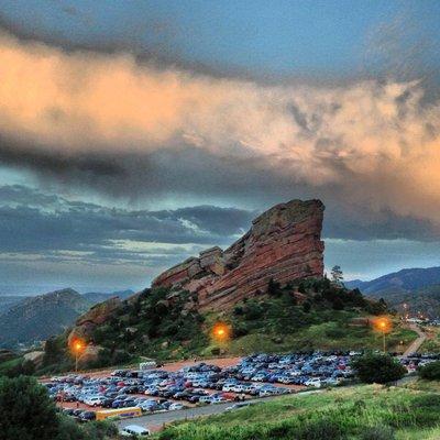 White Denver Snow Limo van in Upper North Lot at Red Rocks Amphitheatre call 303-214-8077