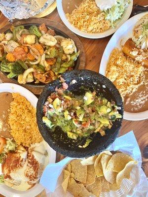 Guac, chicken chimichangas, chicken chalupa and enchilada, veggie fajitas