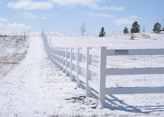 Farm/Ranch split rail Vinyl fencing with 3 rail option in white. Residential install.