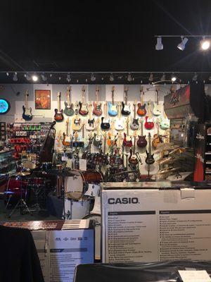 Variety of electric guitars and acoustic