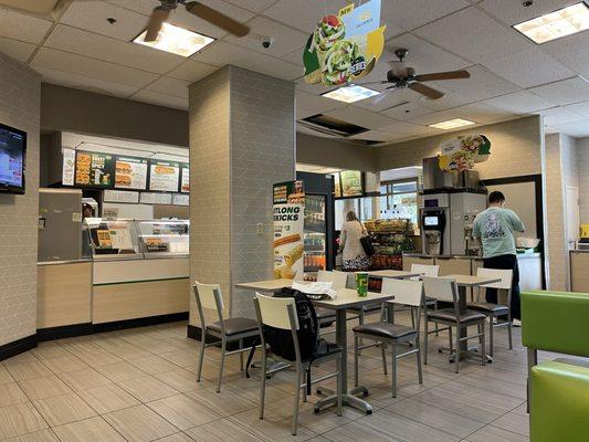 Dining area at Subway.  Notice the ceiling tiles, some of which are broken or missing