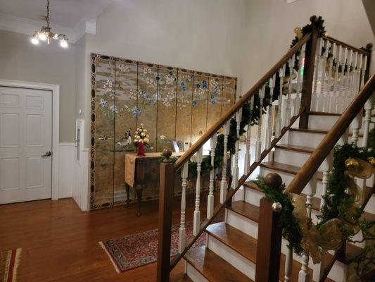 View of decoration and staircase near front door....