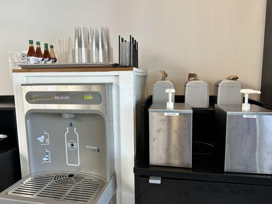 Self-serve water station and sauces