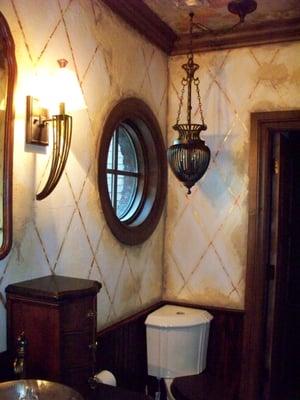 Harlequin motif with distressed plaster and gold and silver leaf accents