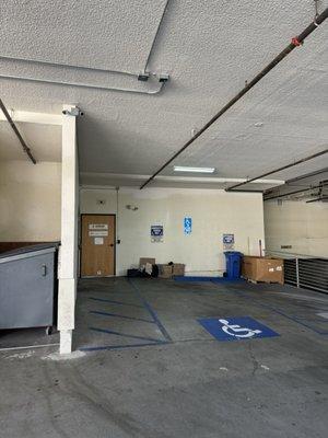 Enter through the door in the parking structure area