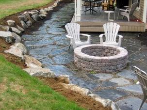 Installed a granite rock wall, flagstone pathway/patio and a cottage stone fire-pit.