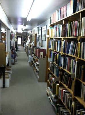 View from about halfway back. Neatly organized. (For a used book store!)