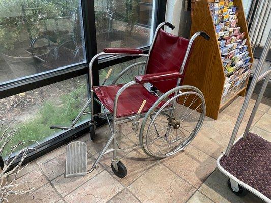 1920 era insane asylum wheel chair. 1st floor only amenity as there are no elevators. You'll need to crawl up the stairs.