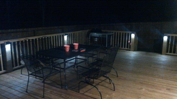 T and D deck finished with recommended wood finish and lights mounted