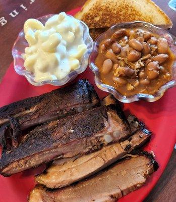 Sliced brisket, ribs, mac & cheese and ranch beans