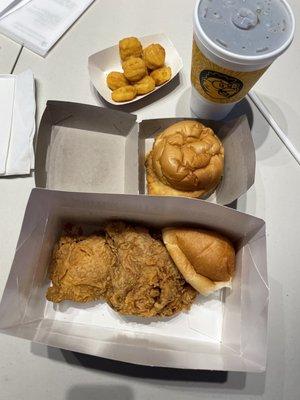 Two piece combo with corn nuggets and dinner roll, chicken sandwich, and drink $14