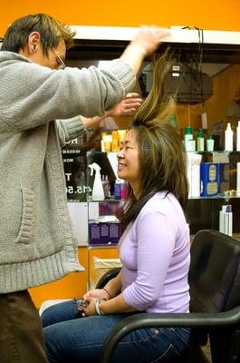 Li styling a customers hair.