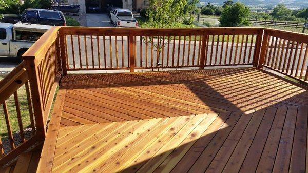 Redwood deck, wood railing, cabots natural stain and screwless fastening system(zoom in-no holes in surface)