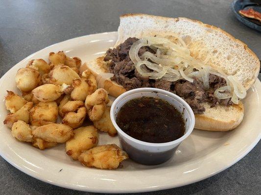 Delicious steak sandwich with fresh fried curds.