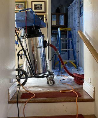 Cleaning the ducts eleuthera this equipment. Note floors covered with plastic. Not a speck of dust  remained after work was complete.