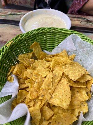 Cheese and bean dip with chips.