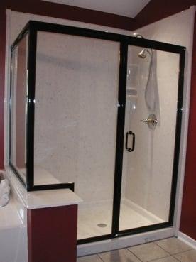 Framed corner shower door