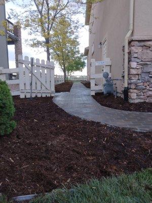 This is a paver pathway and mulch installation