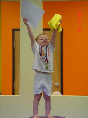 My son earning his medal and next shirt