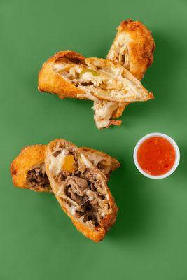 Crispy Egg Rolls stuffed with Ribeye Steak or Chicken, Onions, Peppers, Provolone and Mozzarella Cheese.