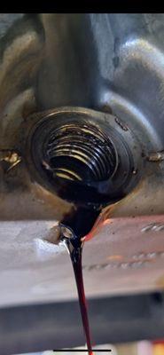 Oil pan drain plug stripped by Ford mechanics