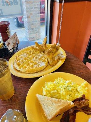 Chicken and waffles, eggs, toast and bacon