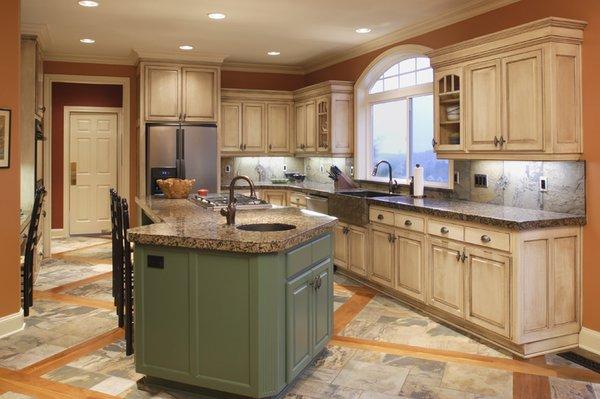 Kitchen with Granite Counters, Custom Built Island, Cabinets and Drawers and Beautiful Tile Flooring