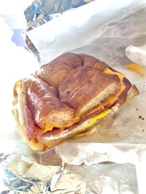 Pork roll, egg, and cheese on a croissant