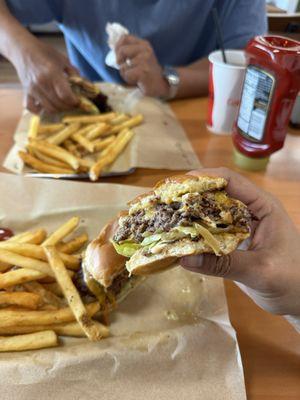 the 50/50 burger with lettuce, sauce, and grilled onions