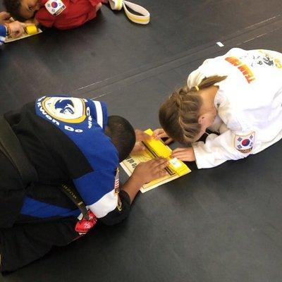 daughter getting her yellow belt