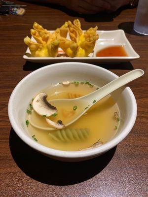 Chicken broth soup with mushrooms and crab rangoon