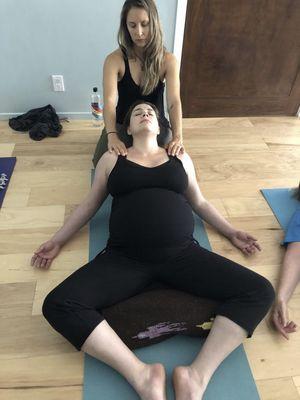 Hands-on adjustments/massage during prenatal yoga