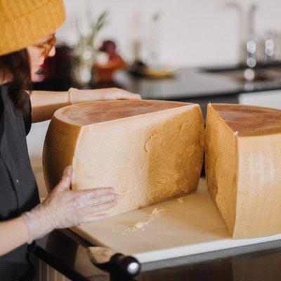 Ali, our cheese buyer, cracks a 24 month aged Parmigiano Reggiano