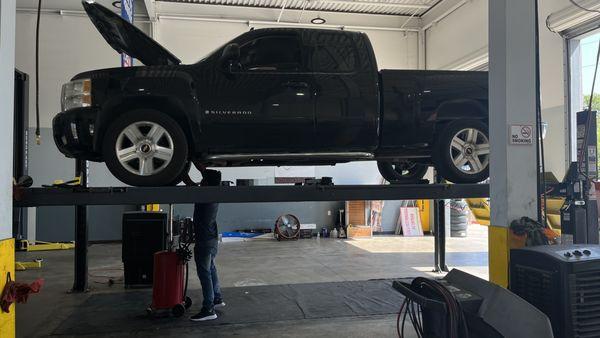 Our mechanic doing an oil change on a 2008 Chevrolet Silverado