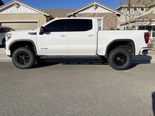 GMC Sierra AT4 with 4" Fabtech suspension lift, 35" BFG K02 tires and 18" Fuel Vapor wheels.