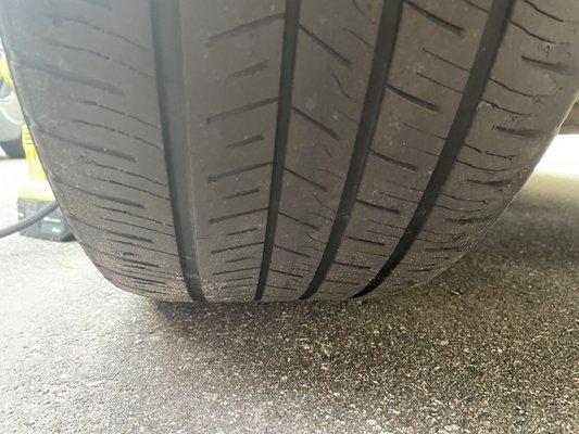 My bald tire that Discount Tire says. You can see the wear bars are still below the tread on left side!