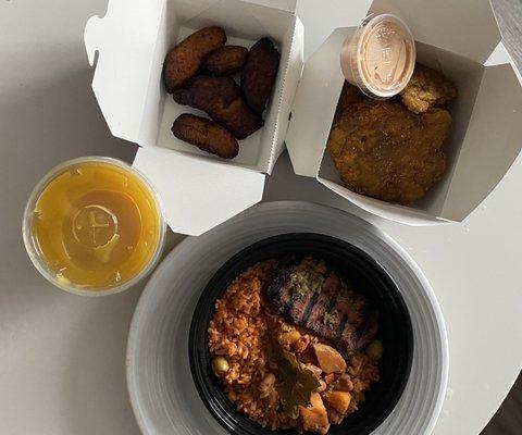 Plantains, tostones, juice, and the pork meal