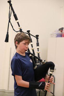 A young bagpiping in the Colorado Youth Pipe Band.