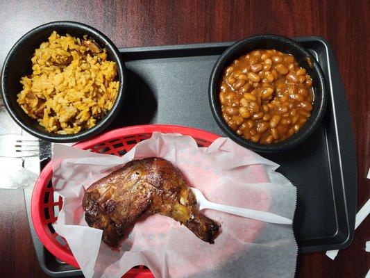 Chicken leg quarter with jambalaya and bakes beans