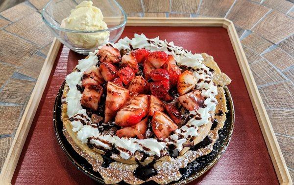 Nutella Belgian Waffle with whipped cream, strawberries, and vanilla ice cream ($12.45, 10/20/24)