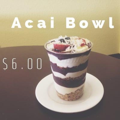 This is our Acai Bowl- Layers of granola, Greek yogurt, Acai, Topped with fresh fruit, coconut and a drizzle of honey.