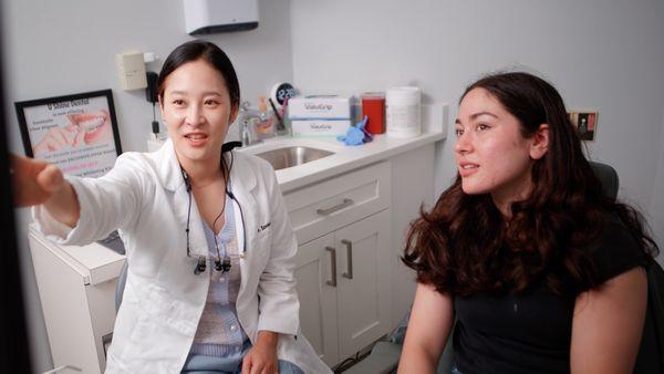 Alexandria dentist Dr. Irene Shin explaining SurSmile procedure