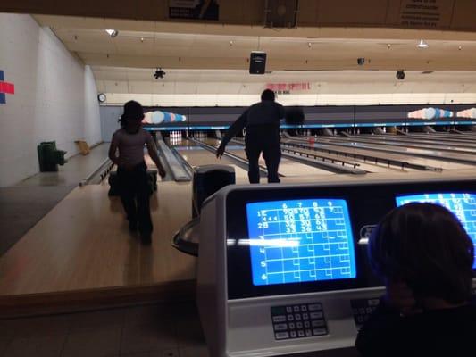 Bowling with two grandsons and my daughter with a black eye.