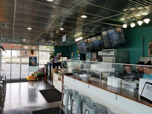 View of counter space with menu visible above the staff.