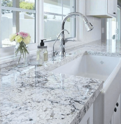 A beautiful kitchen finished with white ice granite countertops