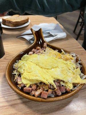 Skillet. Raw hash browns. Cheese not melted