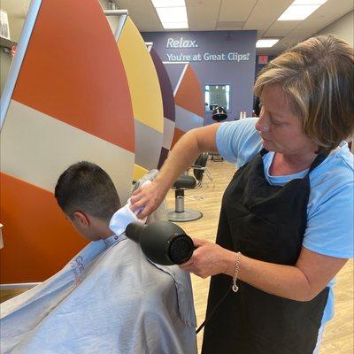 Stephanie cutting my kid's hair.