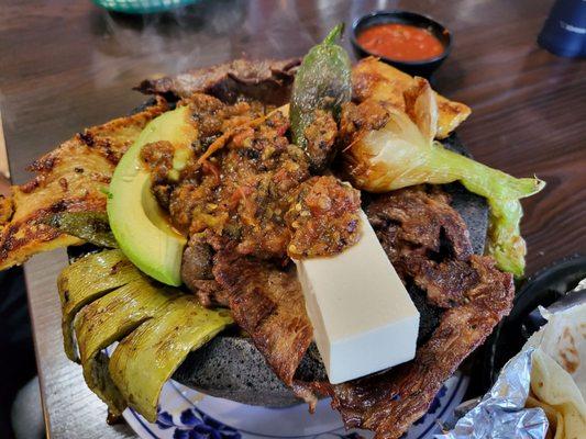 Molcajete Cielo, Mar Y Tierra ($32.99). Comes with rice, beans, and tortilla on the side. So good - highly recommend! 7/3/2022