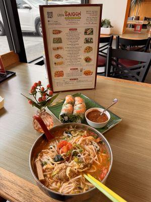 Crab noodle soup with tomatoes, tofu! Large purple mint leaves, bean sprouts , onions, garlic, chili peppers, lime !  Shrimp spring rolls